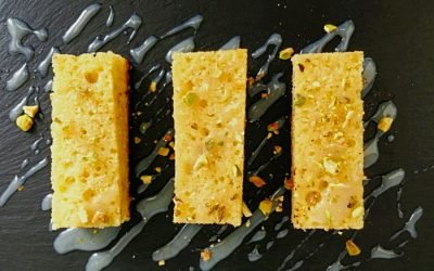 Lemon and olive oil bizcocho with a pistachio-crusted glaze