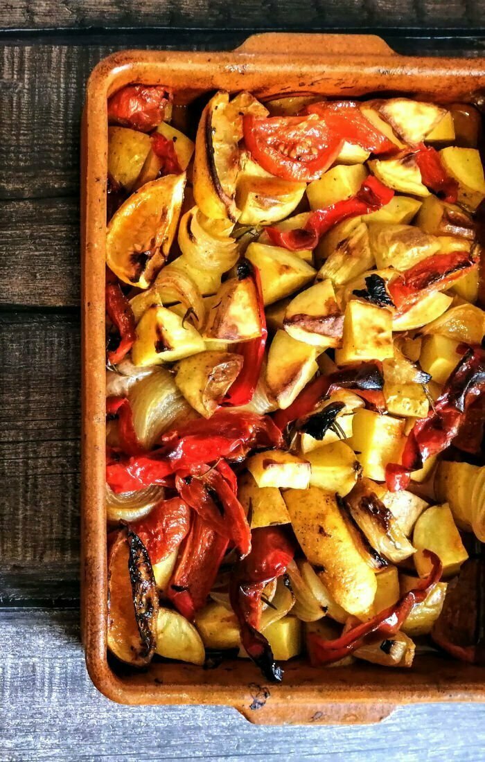 pmp700x1100 The Spanish Radish An eartenware dosh is filled with roasted poor mans potatoes a typical Andalusian dish from Spain