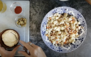 a large bowl is filled with ingredients for an ensalada rusa