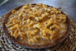 a walnut tart waits to be baked in the oven