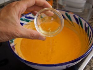 Some sherry vinegar is added to a salmorejo soup