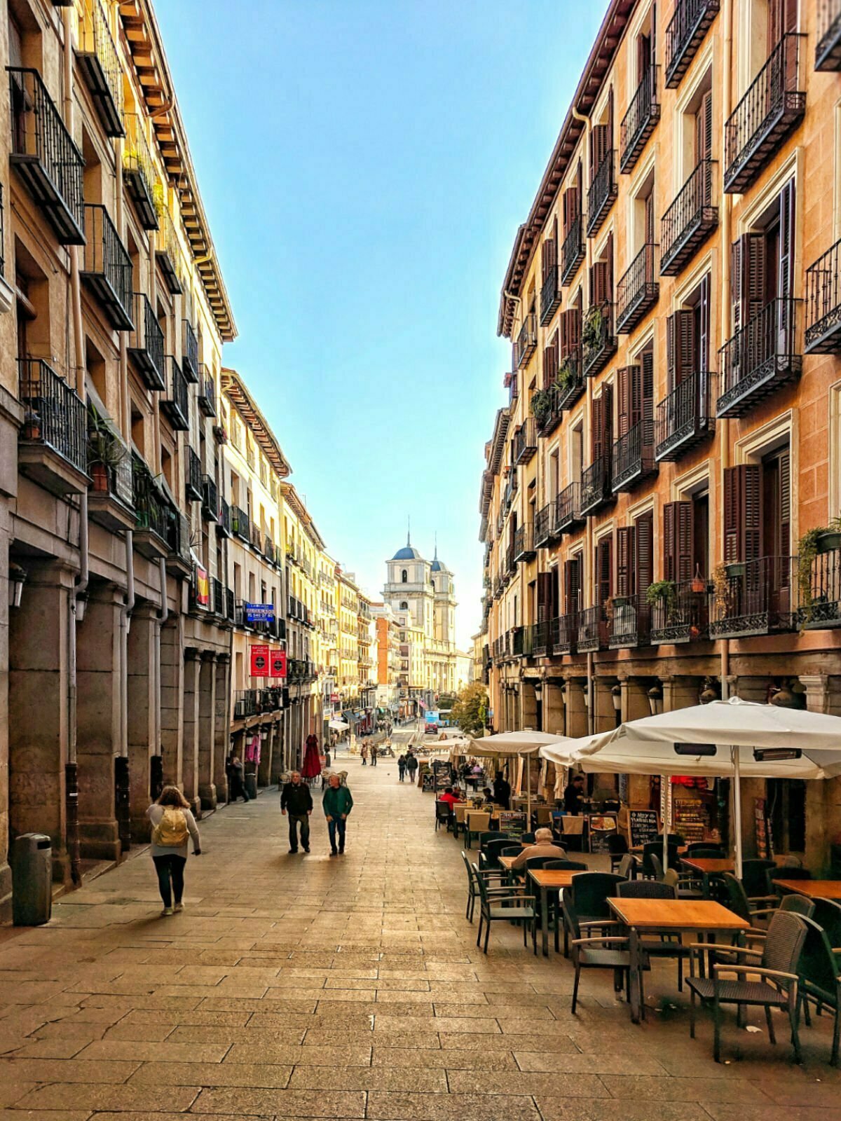 A view down a narrow street leading to Plaza Major in central Madrid.