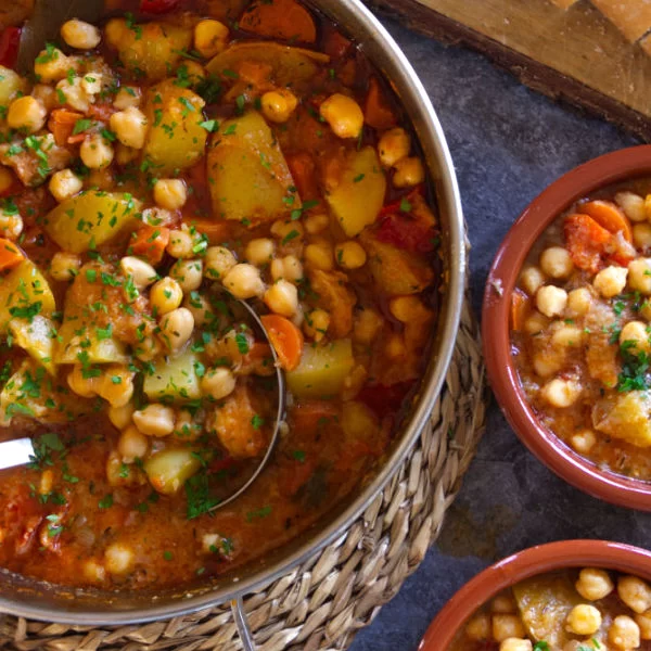 a large pot of chickpea stew Potaje de Garbanzos sit waiting to be served