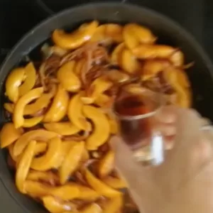 peach slices and some peach syrup are added
