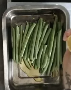Green beans in a small silver baking tray