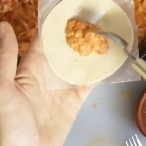 filling is added to the middle of an empanada disk