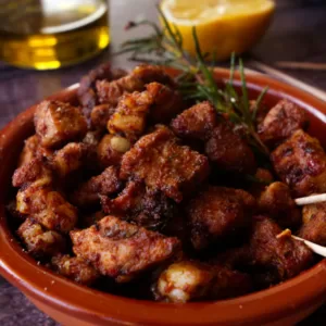A small tapas serving of paprika infused pork bites