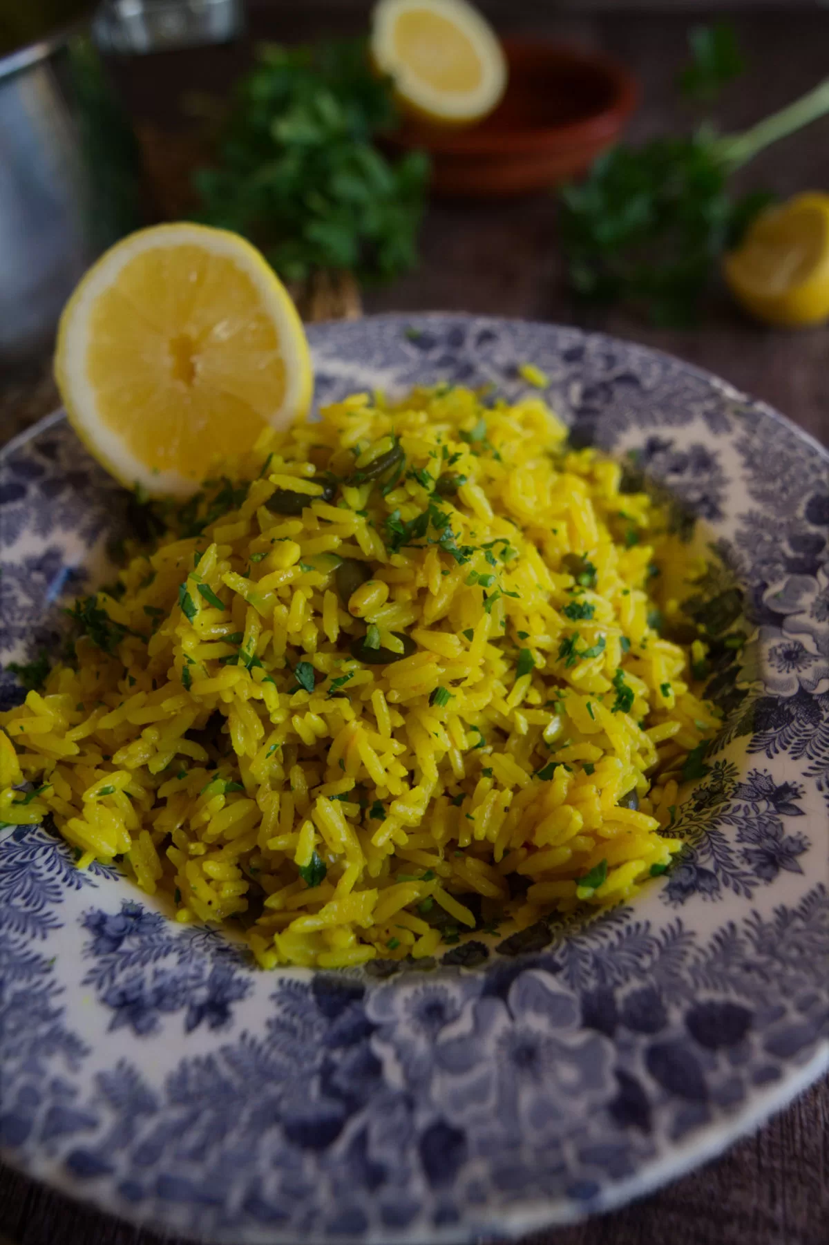 A bowl of Mediterranean yellow rice is served in a decorative bowl