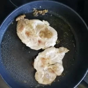 2 pork tenderloins cook in a frying pan