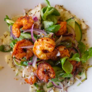 Spicy grilled shrimp with tangy peach salad.