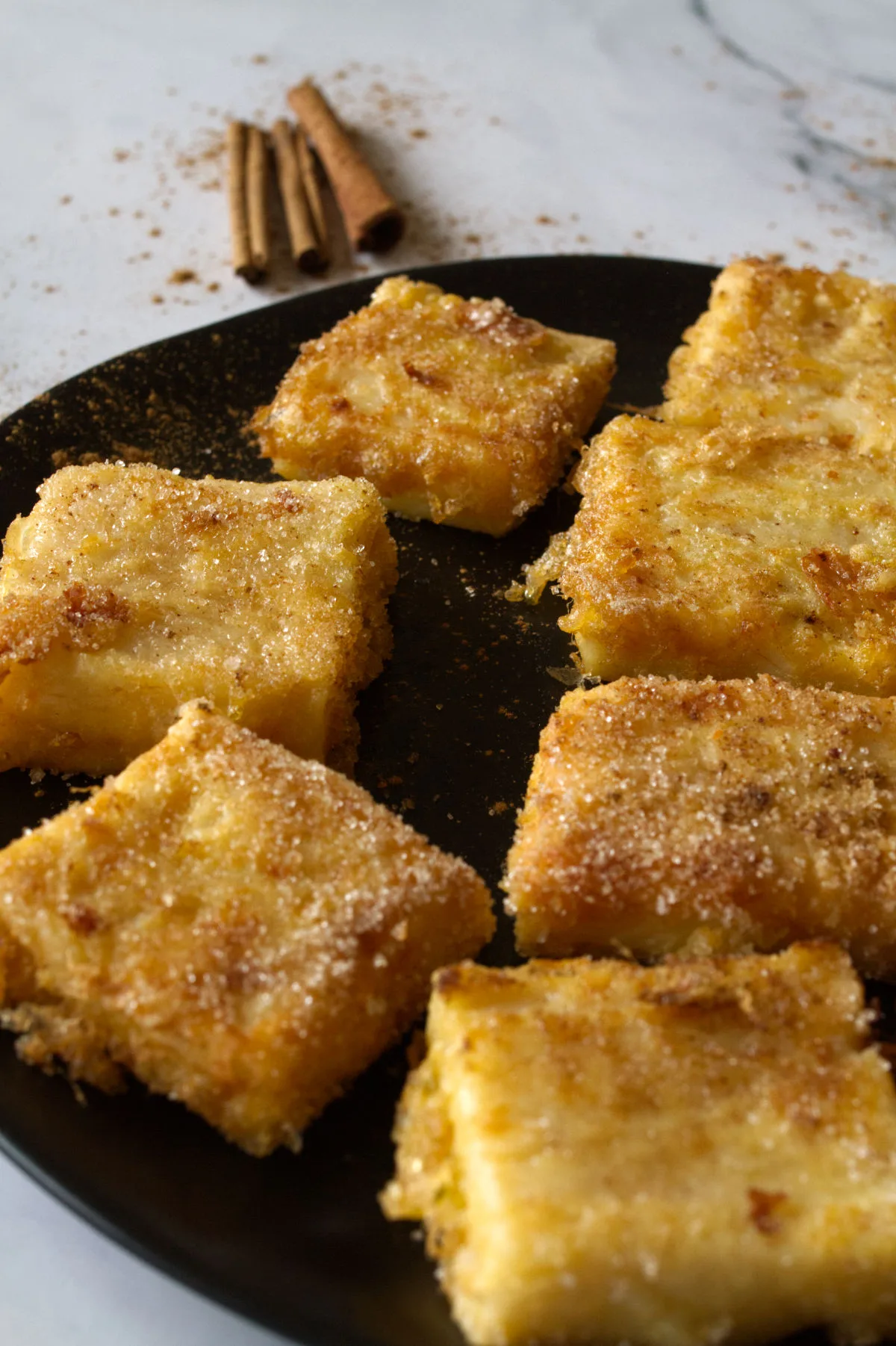 A plate of Leche frita, fried milk squares