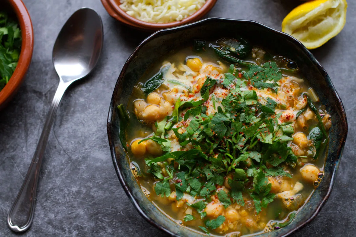 A bowl of spinach and chickpea soup.