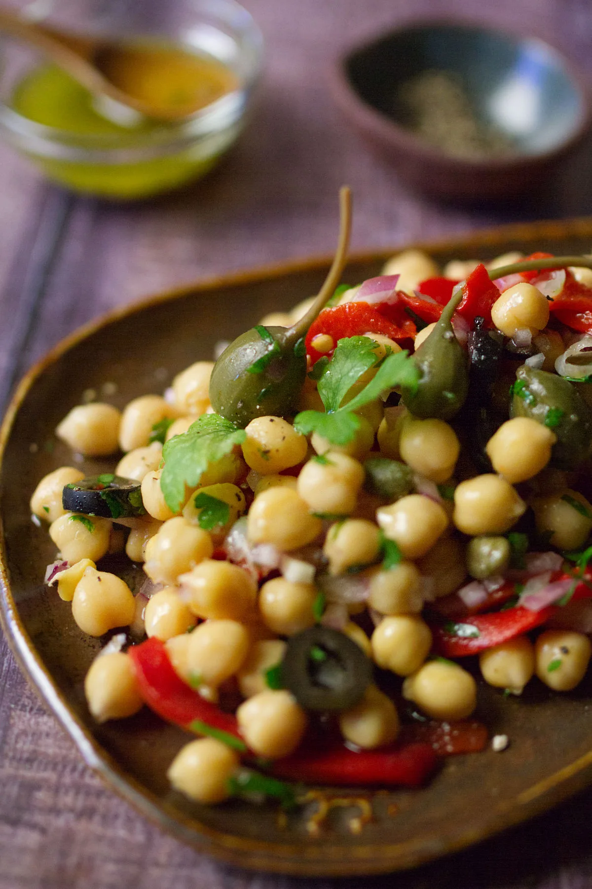 A dish of chickpea and caper salad