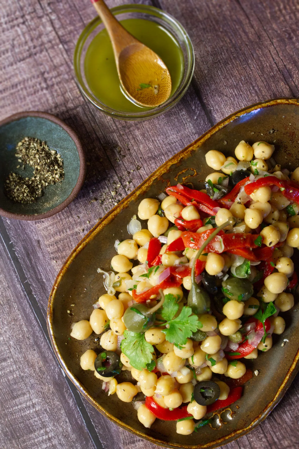 A dish of chickpea and caper salad