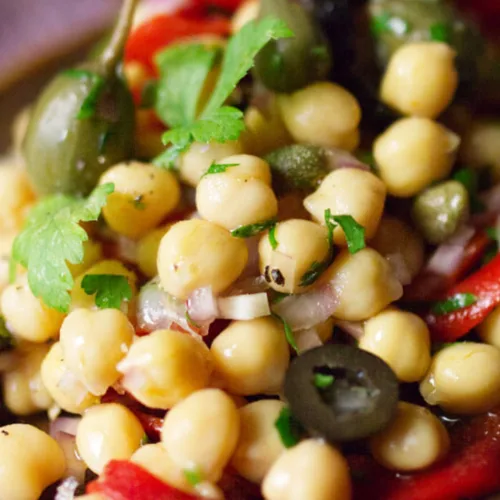 A dish of chickpea and caper salad