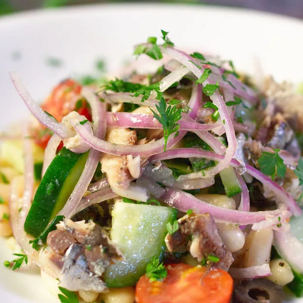 white bean salad with sardines - The Spanish Radish A bowl of white bean salad with sardines