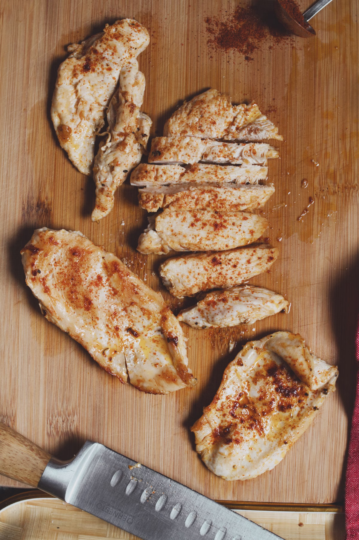 The Best Way To Cook Chicken Breast
Pan-frying chicken breast is the best way for juicy and tender chicken. When baked in the oven, chicken breast meat tends to dry out and become tough and chewy, so we always prefer pan-fried chicken breast meat. 
Cook your chicken breast in a pan on a medium-high heat and with just a splash of oil to stop the breast meat from sticking. 
Go easy on the spices and seasoning
There’s no need to overload your chicken breast with seasoning or marinade it for hours, and this recipe is a simple, yet very effective method for cooking chicken breast on the stovetop. 
Butterfly your chicken breast for faster, easier cooking
By cutting the chicken breast in half you reduce the thickness of the breast meat, allowing it to cook faster. This process is called ‘butterflying’. Besides the advantage of the chicken cooking faster and more evenly, it also allows for the seasoning to penetrate into the breast meat on all sides. 
Use good quality ingredients
As this recipe relies on few ingredients, it’s important to use fresh, good-quality ingredients wherever possible. 
Use free-range chicken: It is tastier and more ethical than cage-raised chickens.
Use good quality olive oil, preferably extra virgin olive oil. 
Use fresh herbs instead of dried herbs. 
Use a good quality Spanish smoked paprika. We love using La Vera Smoked paprika. 