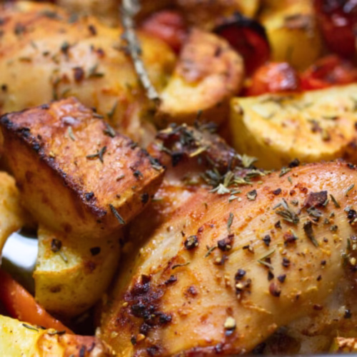 A pan of one-pan chicken and potatoes