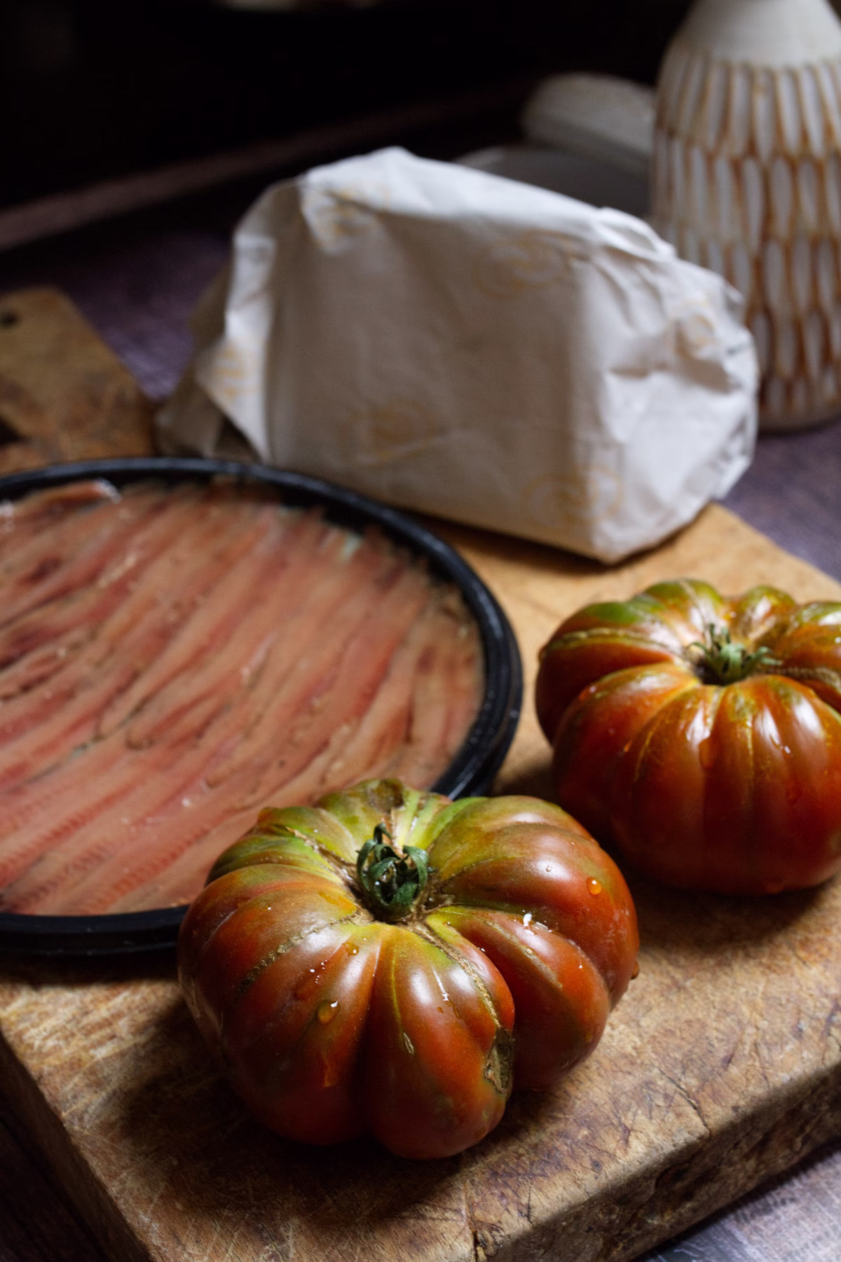 fresh tomatoes, anchovies, and a block of manchego cheese
