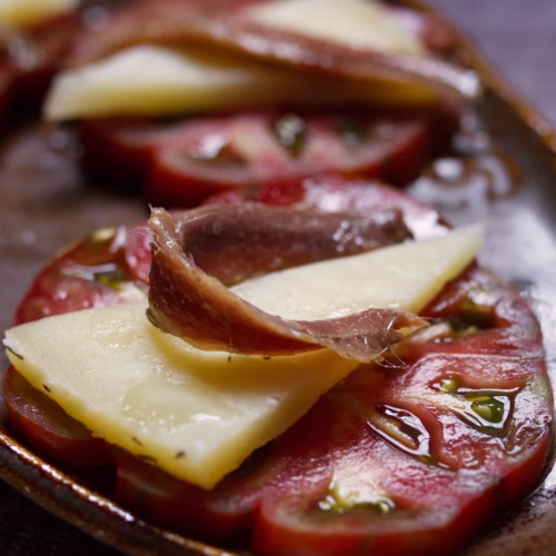 Tomato with manchego and Cantabrian Anchovies