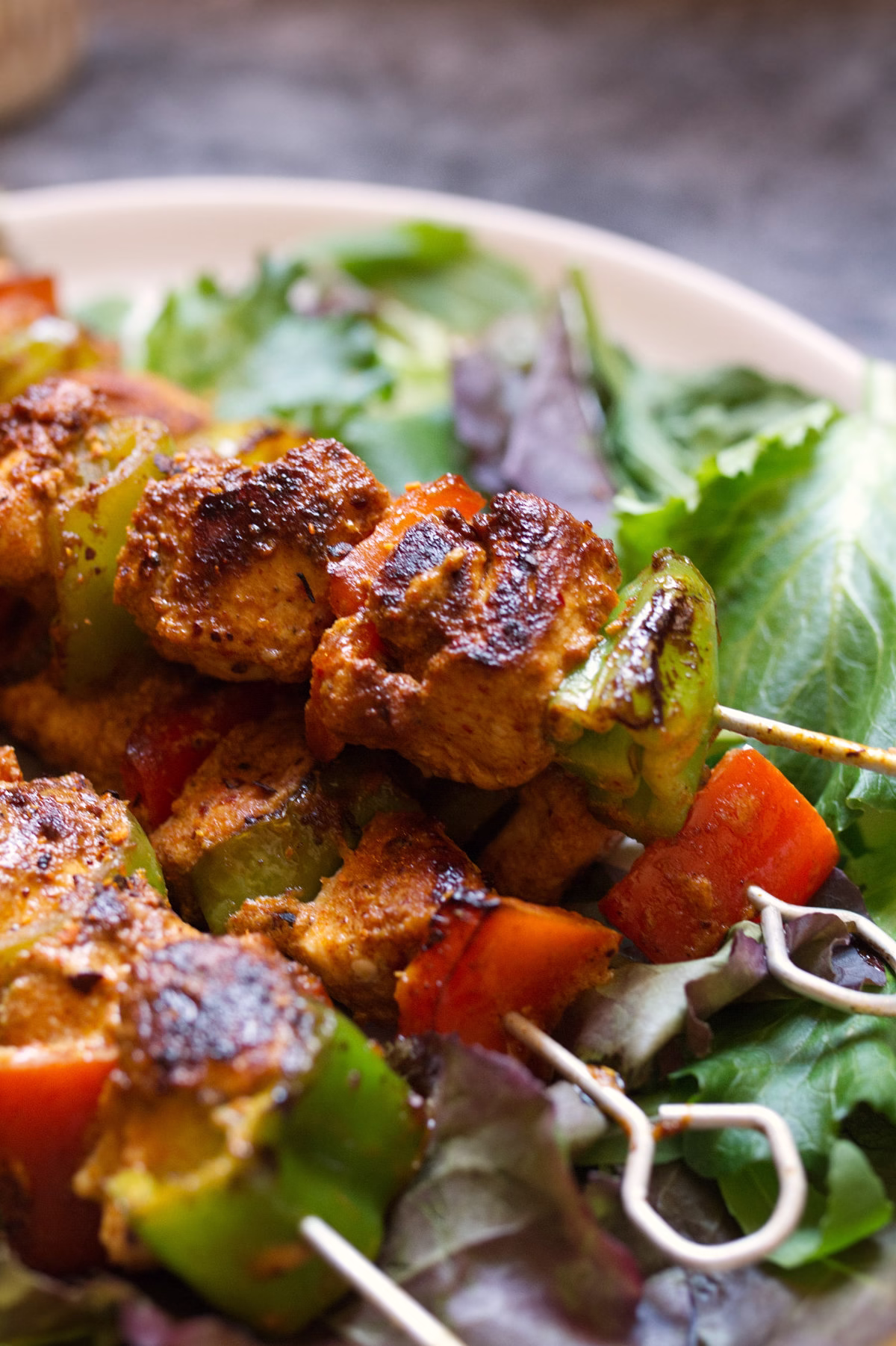 A plate of summery Spanish chicken skewers