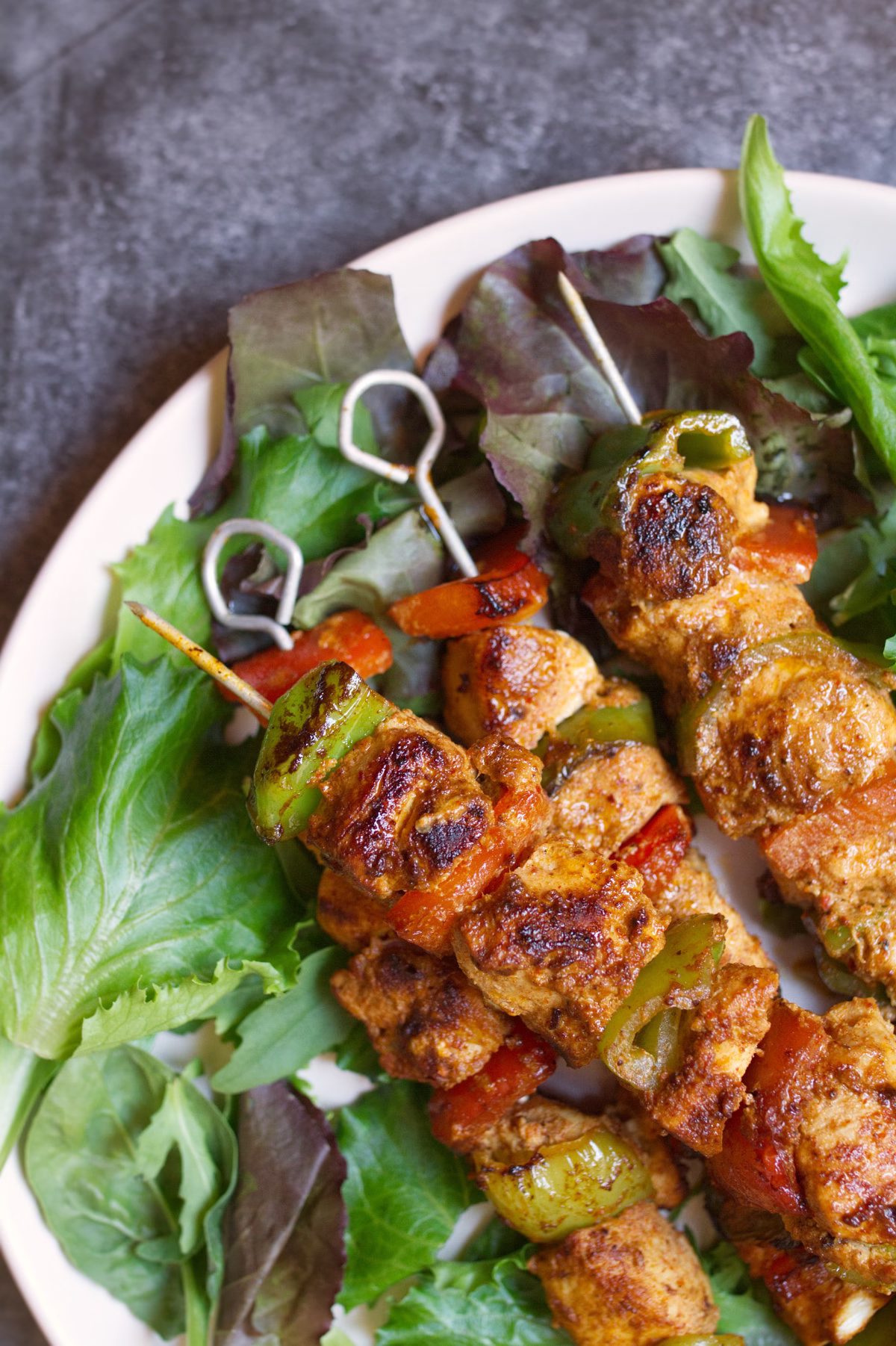 A plate of summery Spanish chicken skewers