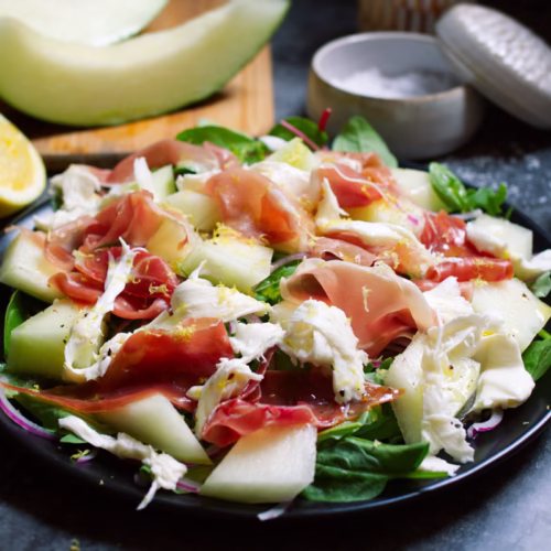 a plate of Summer Salad with Melon, Mozzarella, and Serrano Ham