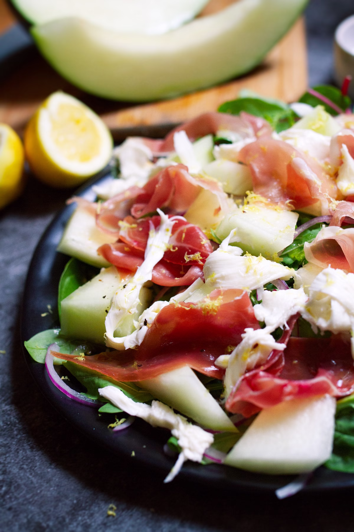 a plate of Summer Salad with Melon, Mozzarella, and Serrano Ham