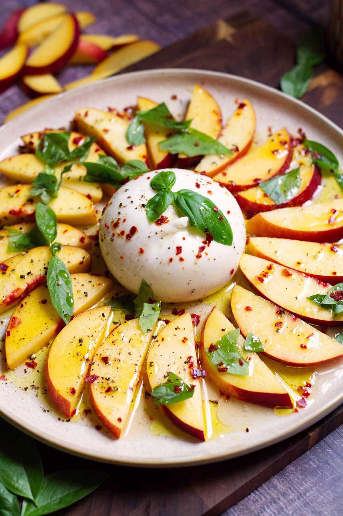 A burrata ball with sliced nectarines