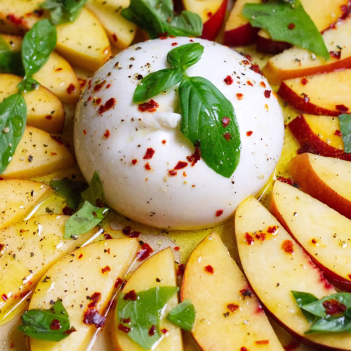 A burrata ball with sliced nectarines