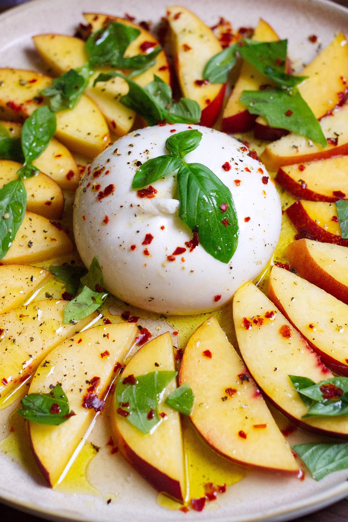 A burrata ball with sliced nectarines