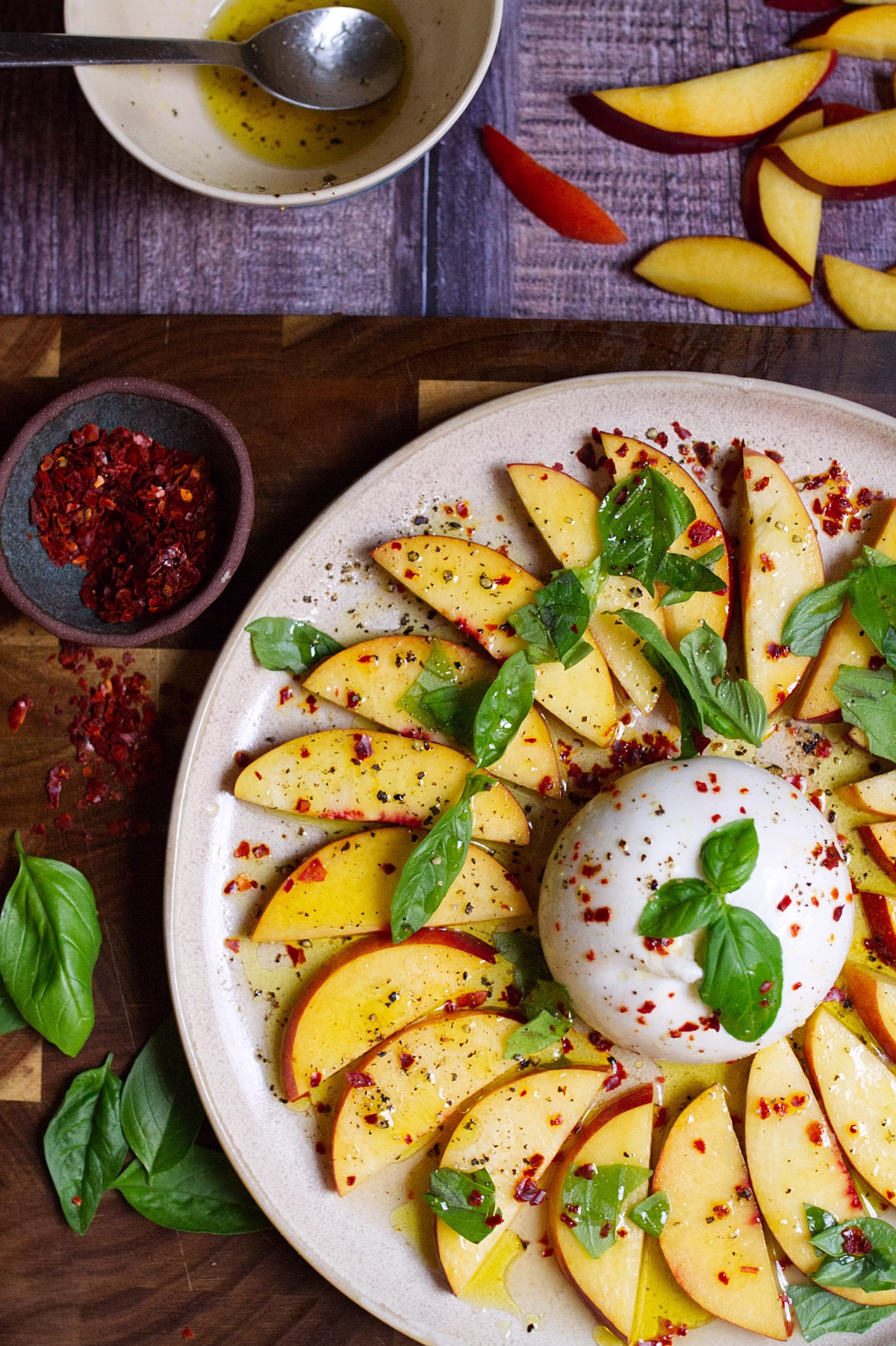 A burrata ball with sliced nectarines