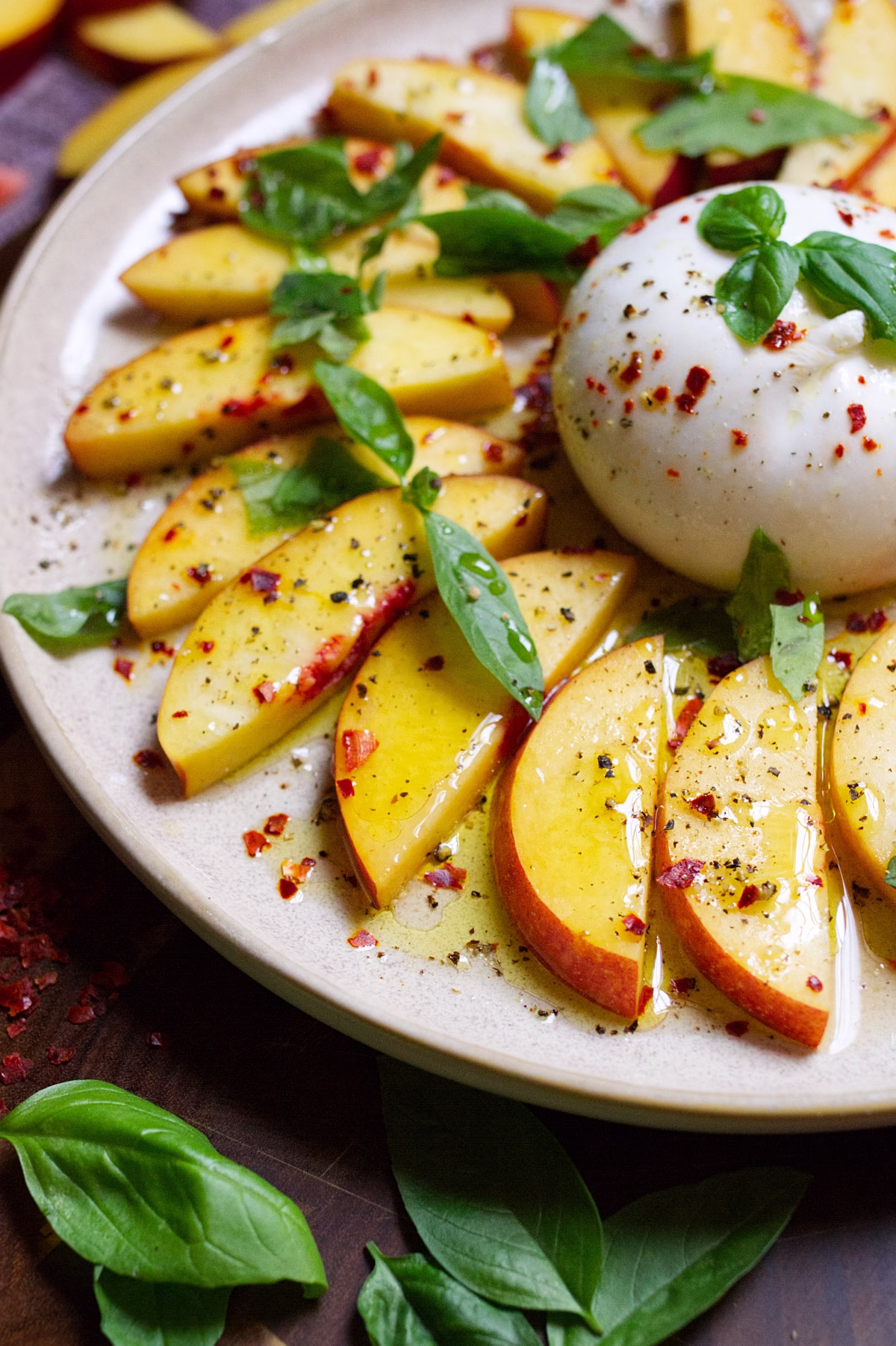 A burrata ball with sliced nectarines