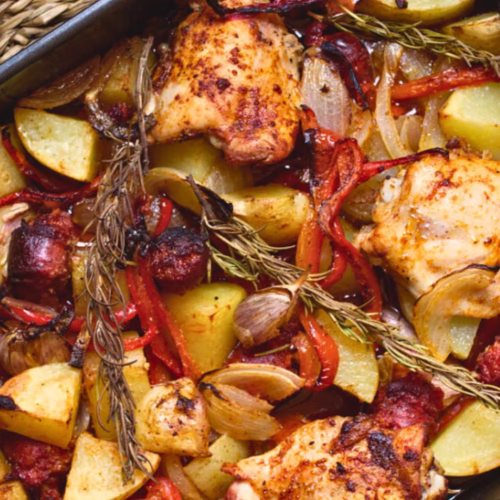 A large pan of Spanish Chicken with chorizo and potatoes