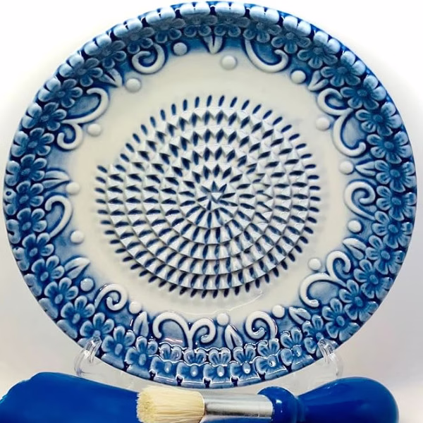 A ceramic garlic grater plate