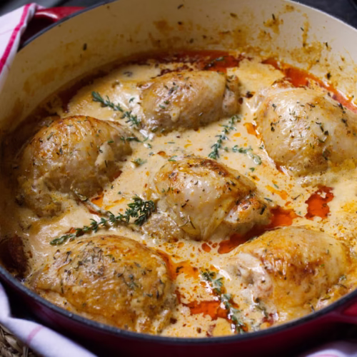 creamy paprika-infused chicken thighs-v2 - The Spanish Radish A large skillet of creamy paprika-infused chicken thighs