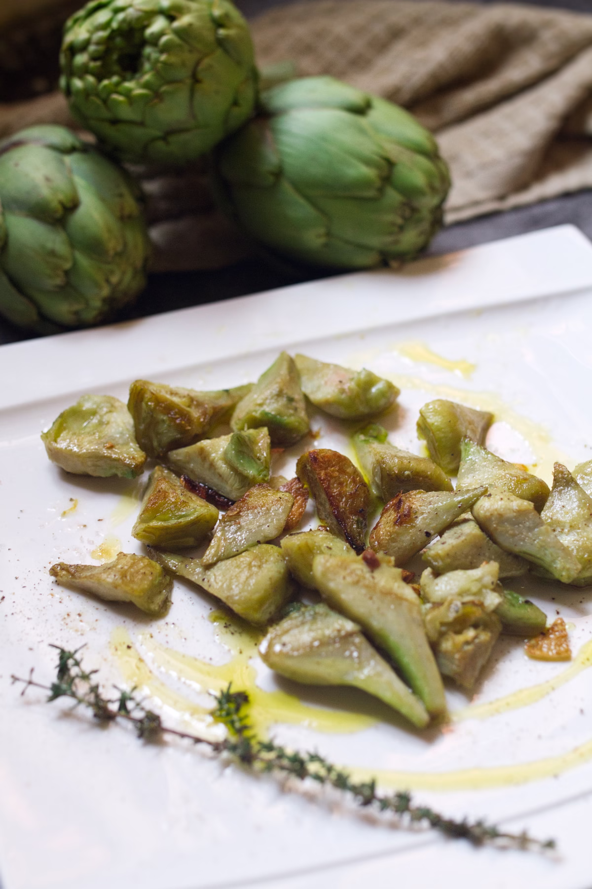 Pan-fried artichokes with garlic lemon-v8 A plate of pan-fried artichoke with garlic and lemon