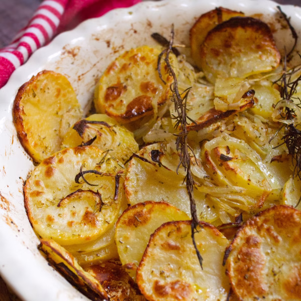 A large pan of Patatas panaderas- Spanish potatoes