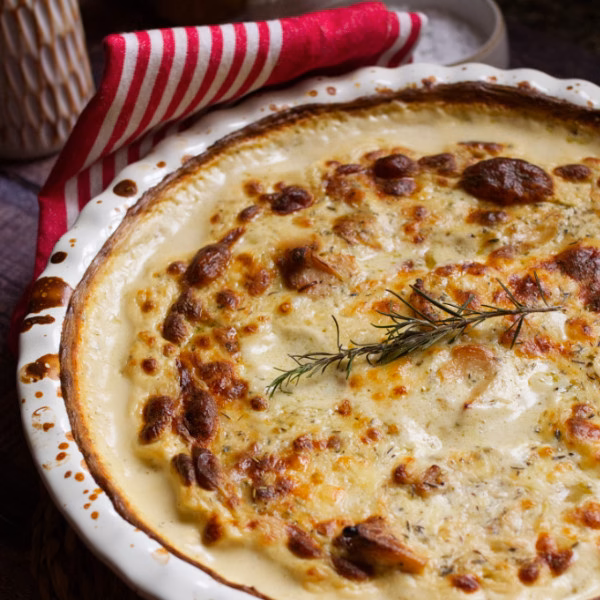 A large dish of Spanish-Style Potato Gratin with Manchego Cheese