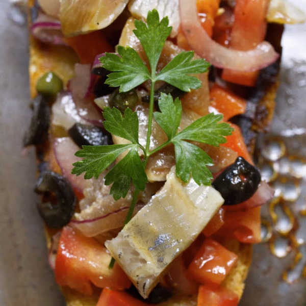 A piece of Spanish style sardine toast