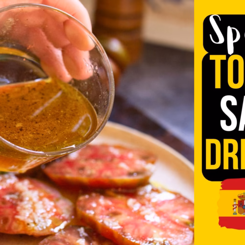 A person pouring Spanish tomato salad dressing from Andalusia over tomatoes