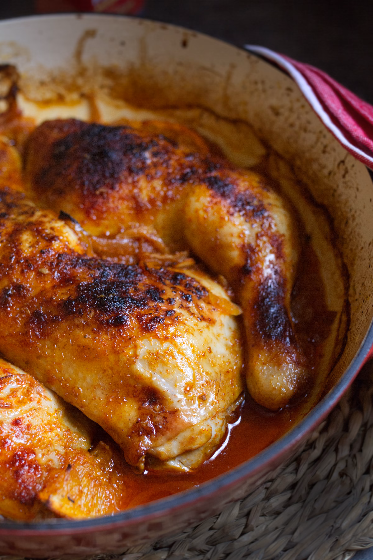 A large dish of Spanish vermouth chicken served with golden crispy chicken skin