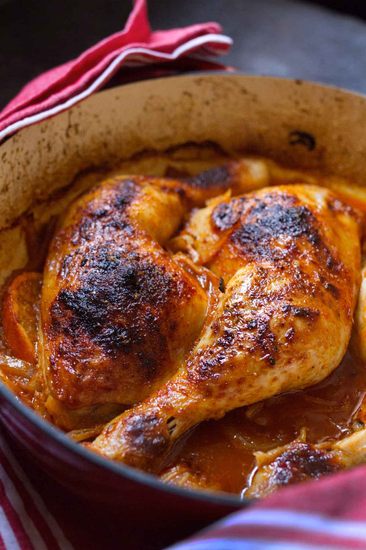 A large dish of Spanish vermouth chicken served with golden crispy chicken skin