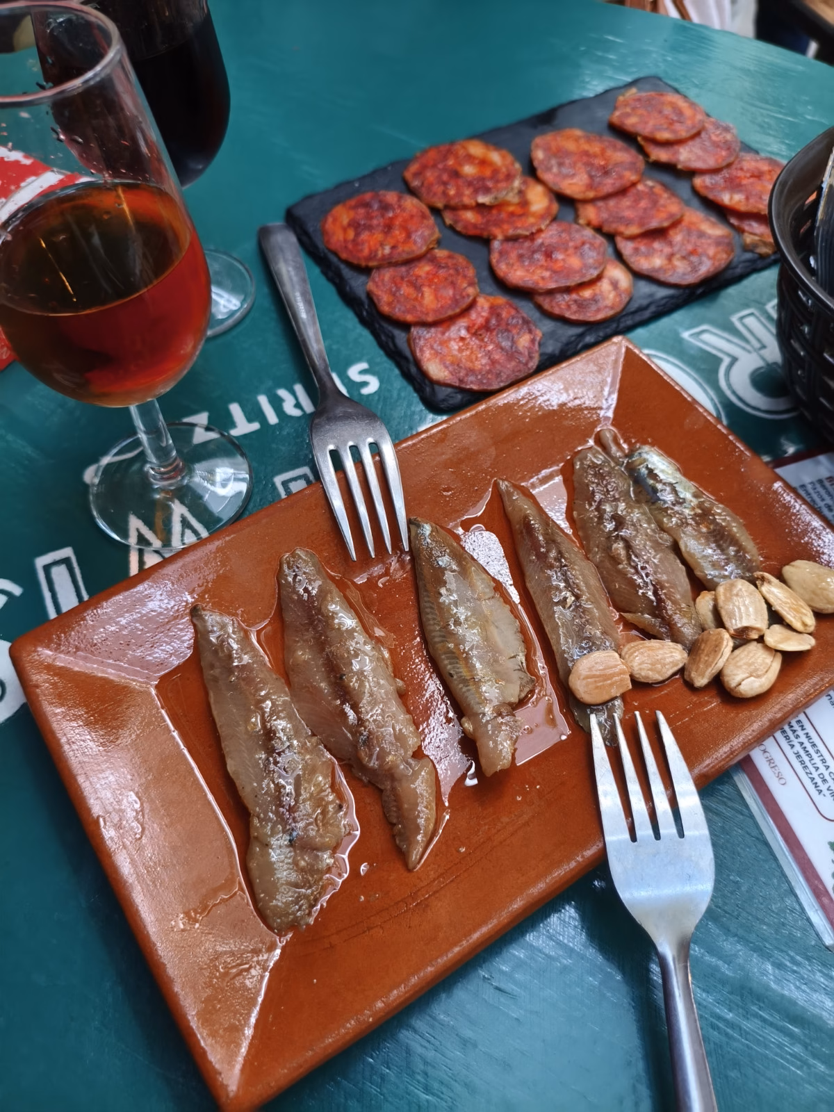 A tapas plate o Smoked sardines and chorizo sausage from tabanco la Jerezana