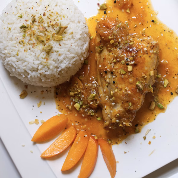 A plate of Spanish-style apricot chicken cooked in Jerez sherry and served with steamed white rice