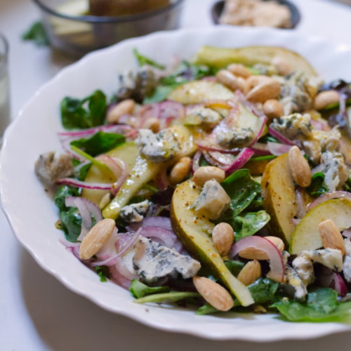 Pear and Blue Cheese Salad - The Spanish Radish a bowl of pear and blue cheese salad