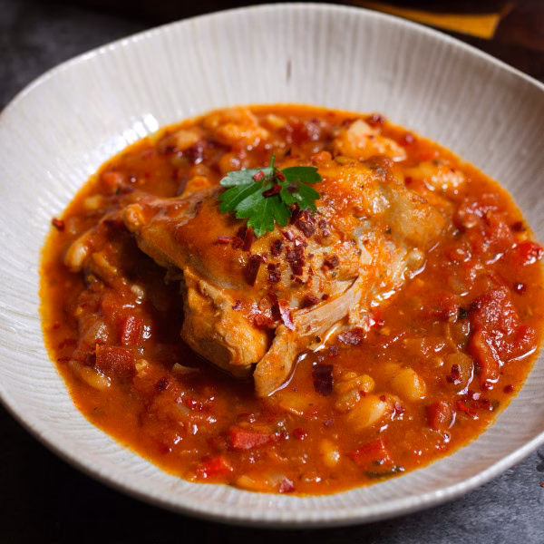 A bowl of Spicy Spanish Chicken Thighs.