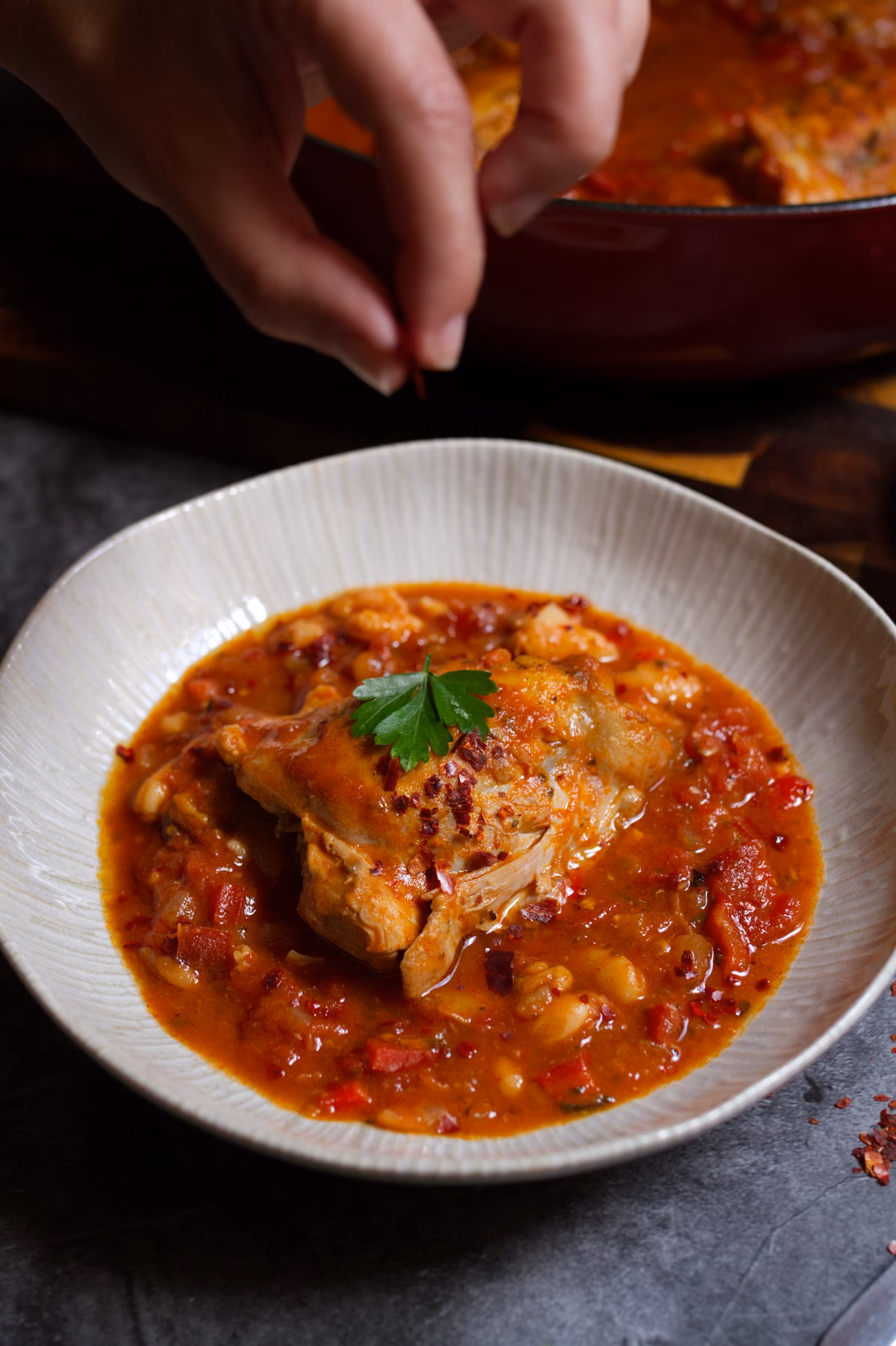 A bowl of Spicy Spanish Chicken Thighs.