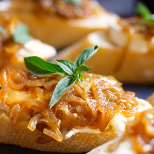 Caramelized Onion and Goat Cheese Montaditos-v40 - The Spanish Radish A Spanish tapas serving of Caramelized Onion and Goat Cheese Montaditos