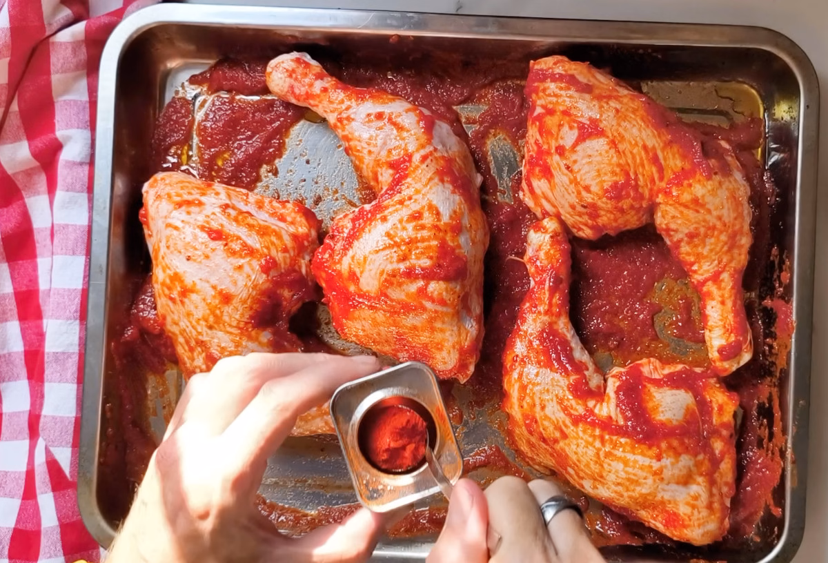seasoned chicken pieces covered in a rich tomato sauce